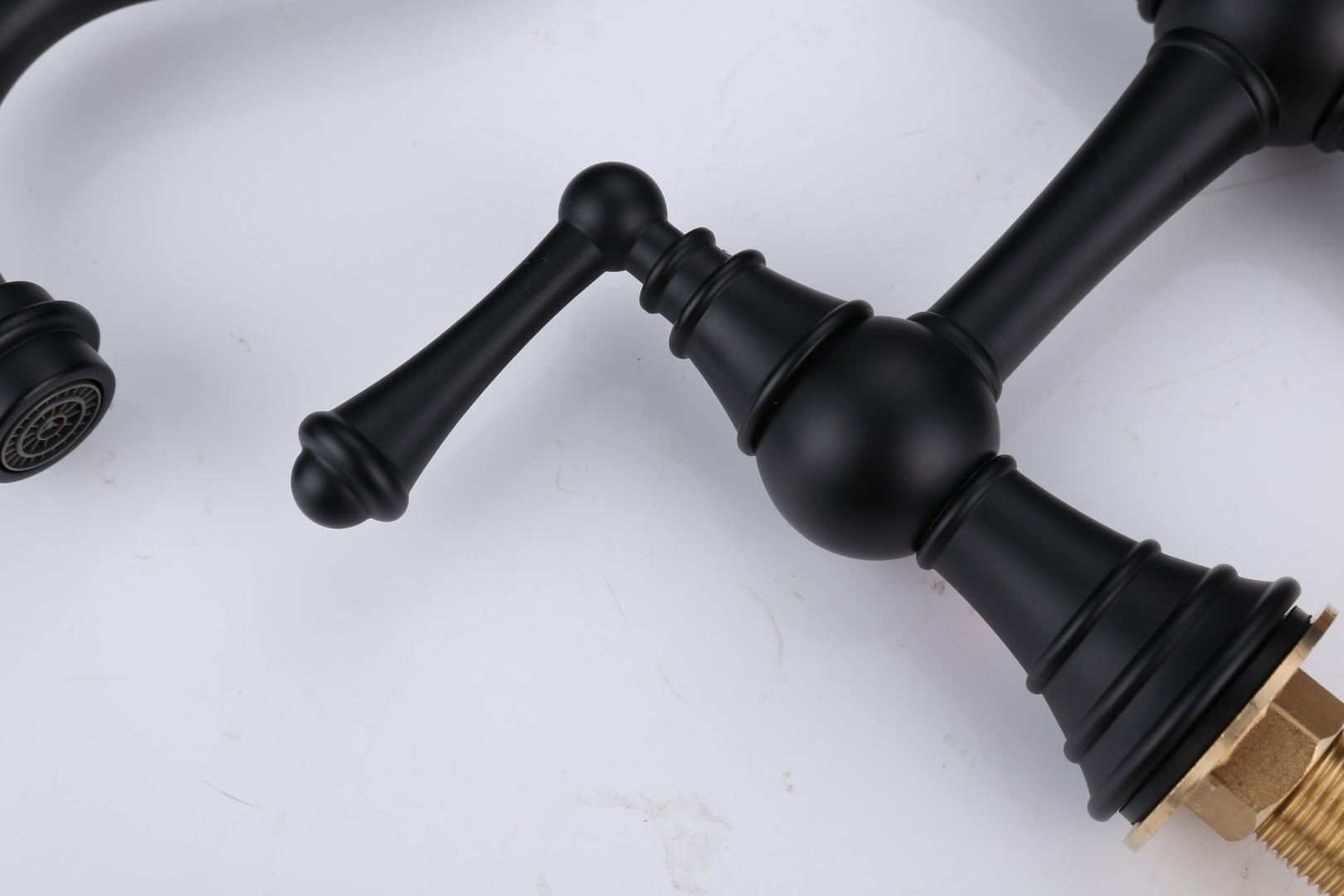 WOWOW matte black lever handle close-up with brass mounting thread
