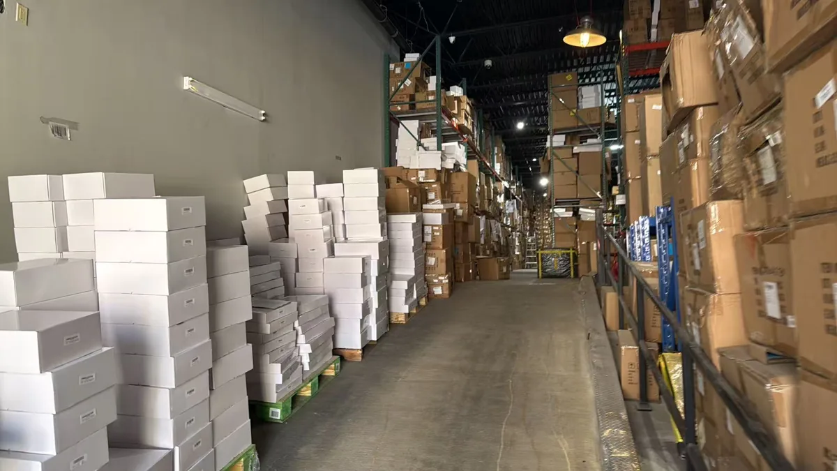 About Us 14 Storage aisle inside WOWOW's New York warehouse